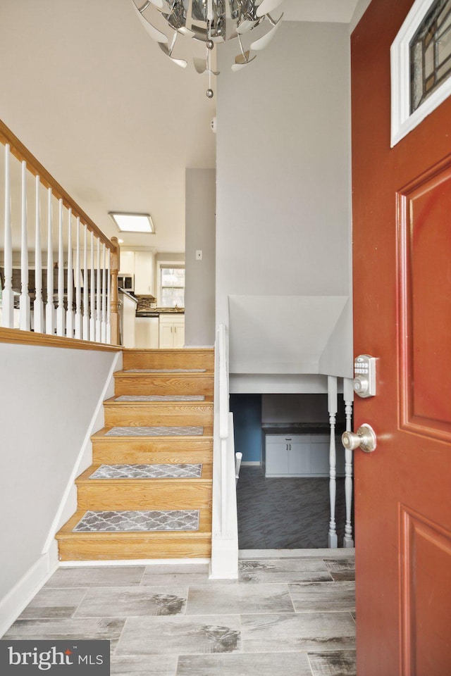 stairs with wood-type flooring