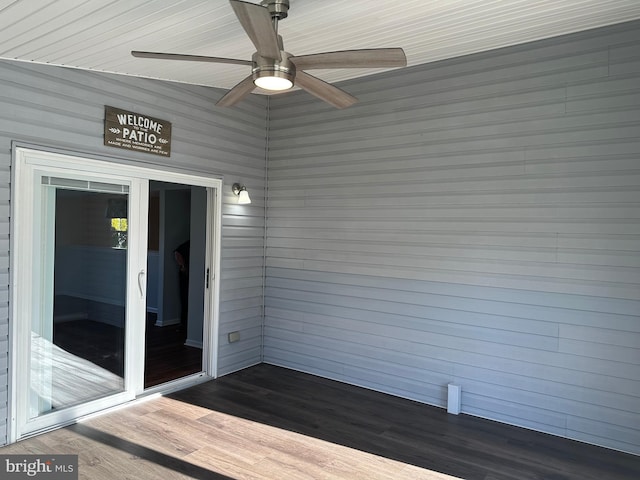 wooden deck featuring ceiling fan