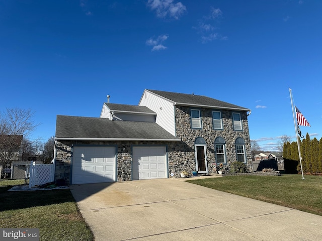 view of front of house featuring a garage and a front yard