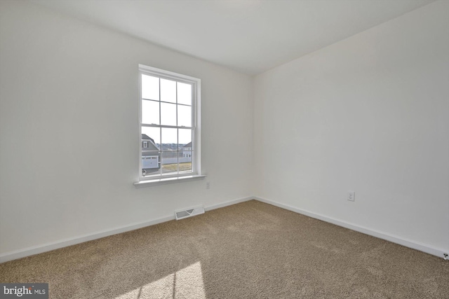 spare room with carpet flooring