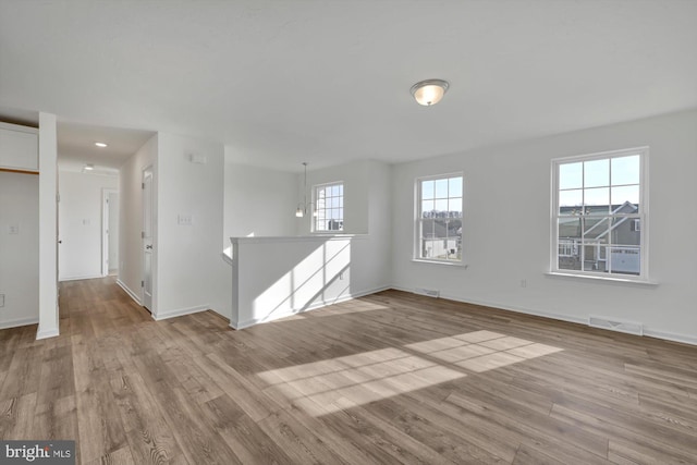 unfurnished room with light hardwood / wood-style flooring