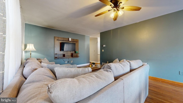 living room with hardwood / wood-style floors and ceiling fan