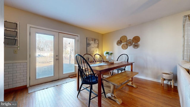 dining space featuring french doors and hardwood / wood-style floors