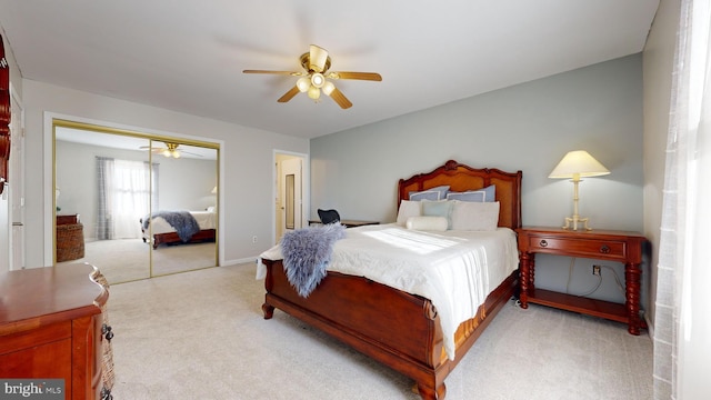 carpeted bedroom with a closet and ceiling fan