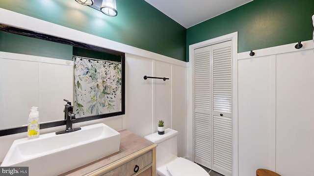 bathroom with vanity and toilet