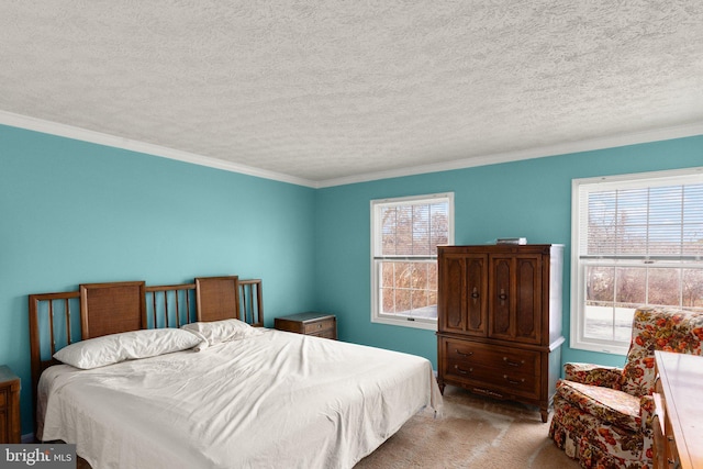 carpeted bedroom featuring ornamental molding and a textured ceiling