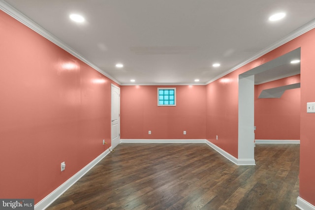 basement featuring dark hardwood / wood-style floors and crown molding