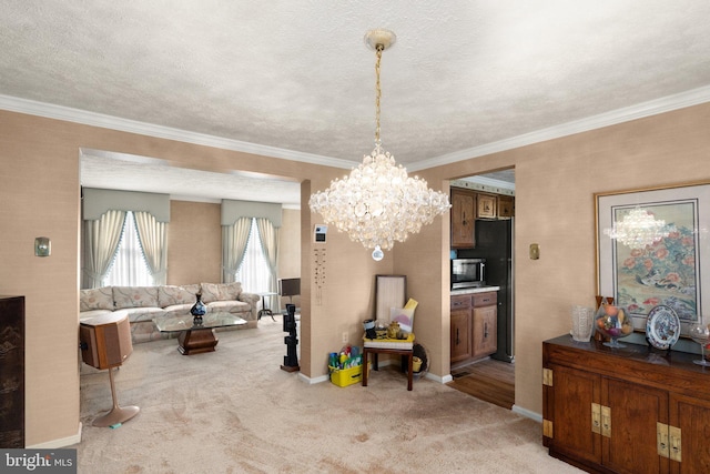 dining area with crown molding, carpet floors, a textured ceiling, and an inviting chandelier