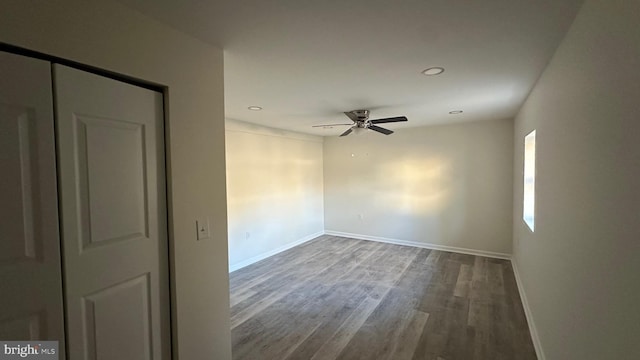 spare room featuring hardwood / wood-style flooring and ceiling fan