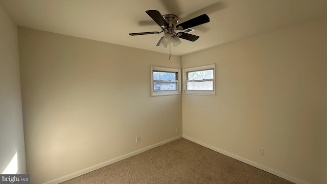 unfurnished room with carpet and ceiling fan