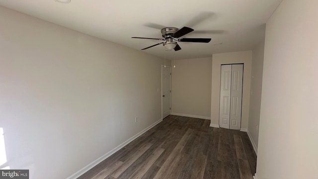 interior space featuring ceiling fan and dark wood-type flooring