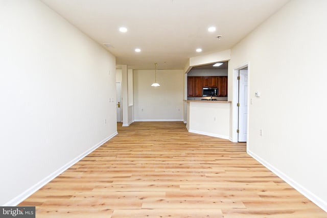 unfurnished living room featuring light hardwood / wood-style floors