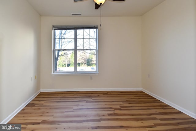 spare room with ceiling fan and light hardwood / wood-style floors