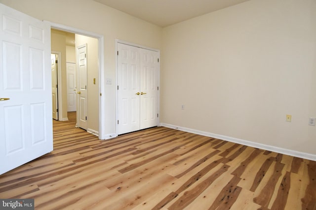 unfurnished bedroom featuring light hardwood / wood-style flooring