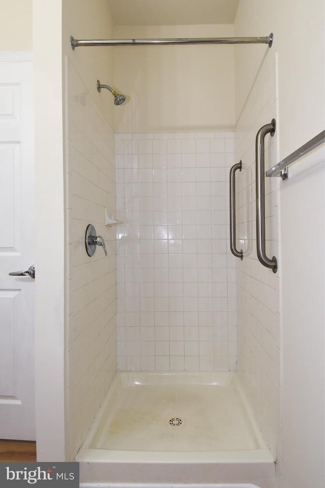 bathroom with tiled shower