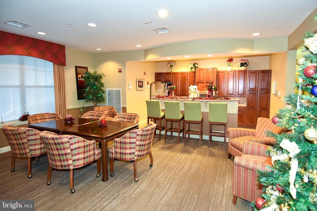 dining area with light hardwood / wood-style flooring