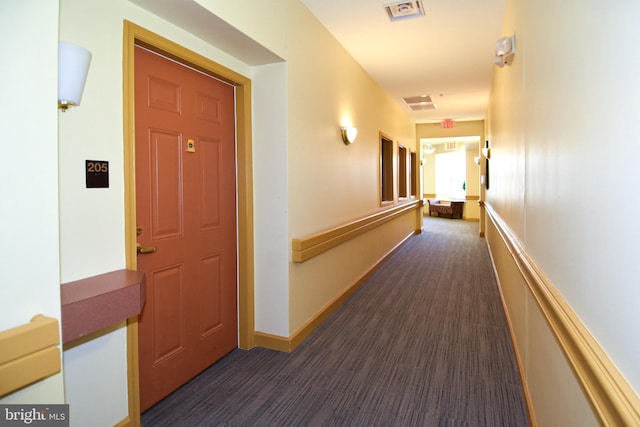 hall with dark hardwood / wood-style flooring