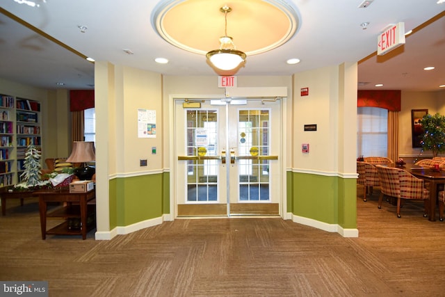 entryway with a wealth of natural light, french doors, and parquet floors