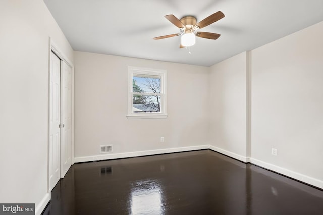 unfurnished room with ceiling fan