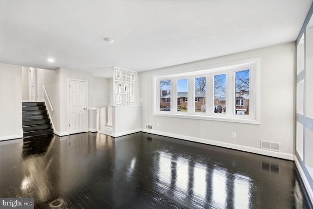 unfurnished living room with hardwood / wood-style floors