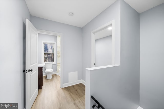 bathroom featuring toilet and hardwood / wood-style flooring