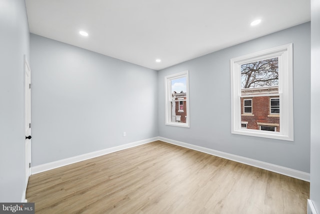 spare room featuring light hardwood / wood-style flooring