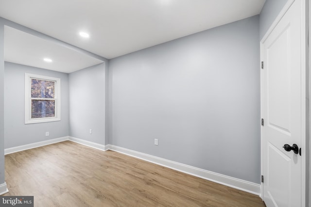 empty room with light hardwood / wood-style floors