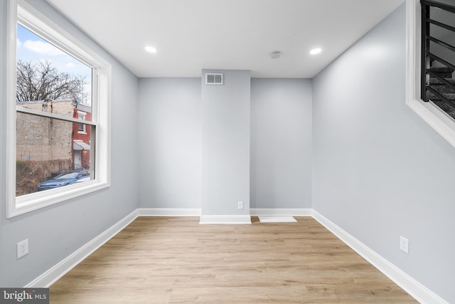 spare room featuring light hardwood / wood-style floors