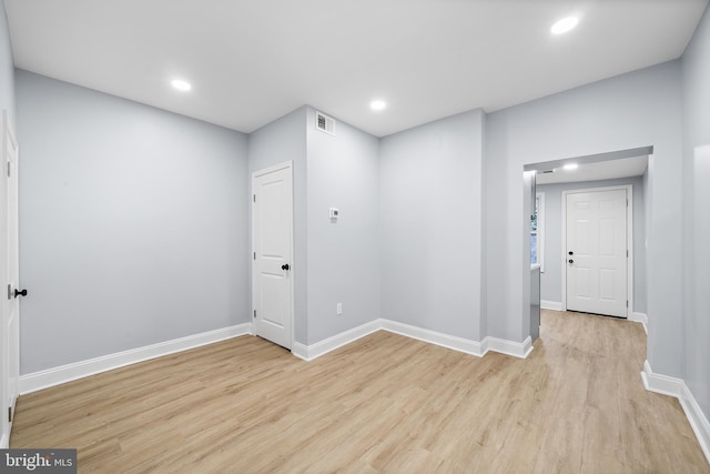 unfurnished room featuring light wood-type flooring