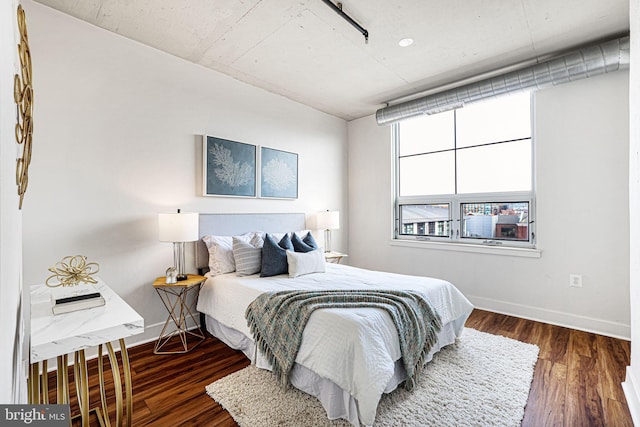 bedroom featuring dark wood-type flooring