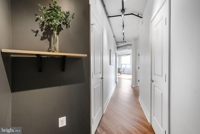 corridor featuring light wood-type flooring