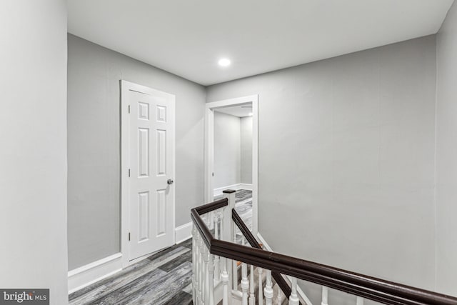 hall with wood-type flooring