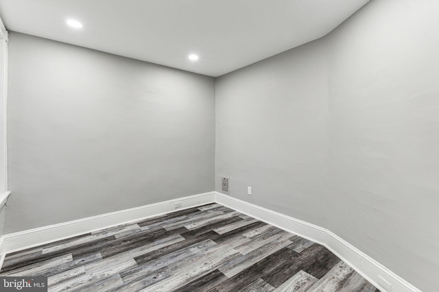 spare room featuring dark hardwood / wood-style flooring