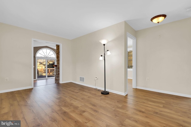 spare room with wood-type flooring