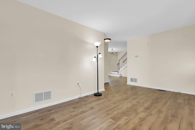 empty room featuring hardwood / wood-style flooring