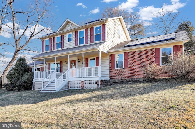 view of front of house featuring solar panels, a porch, and a front lawn