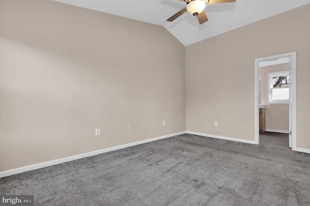 carpeted empty room with ceiling fan and lofted ceiling