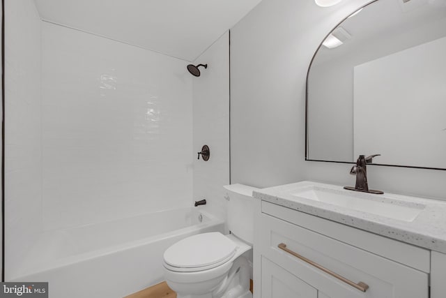 full bathroom featuring vanity, toilet, and tiled shower / bath