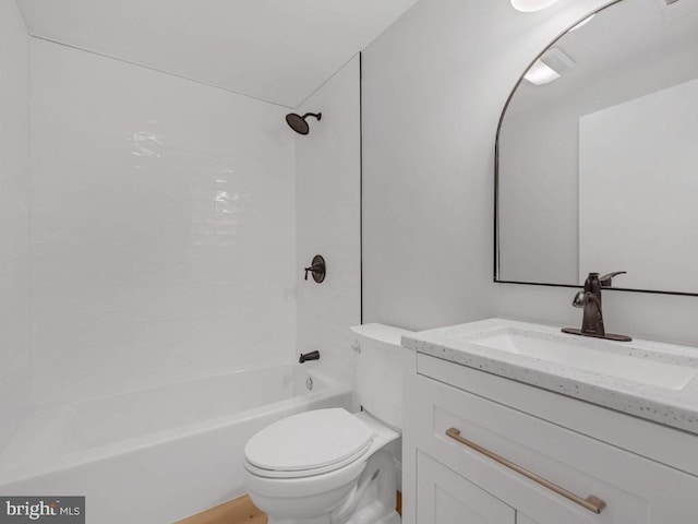 full bathroom featuring vanity, toilet, and tiled shower / bath