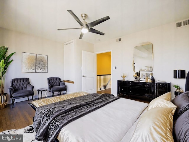 bedroom featuring ceiling fan and dark wood-type flooring