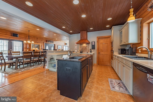 kitchen featuring wooden ceiling, cream cabinets, sink, decorative light fixtures, and stainless steel appliances