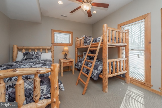 carpeted bedroom featuring ceiling fan