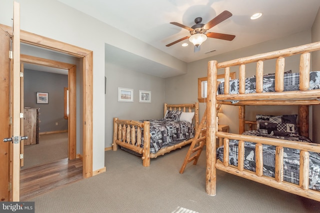 bedroom with ceiling fan and wood-type flooring