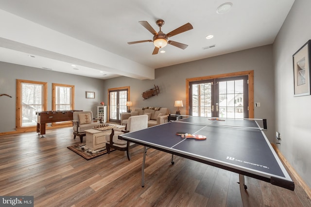 playroom featuring hardwood / wood-style floors, ceiling fan, french doors, and a healthy amount of sunlight