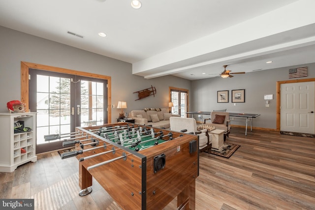 playroom with ceiling fan, french doors, and wood-type flooring