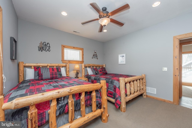 bedroom featuring ceiling fan and carpet