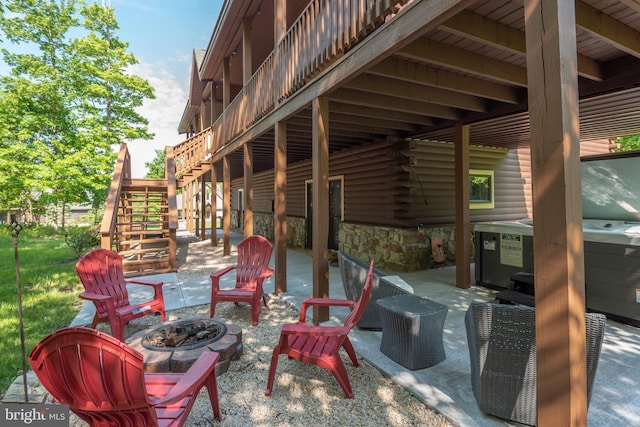 view of patio with a fire pit