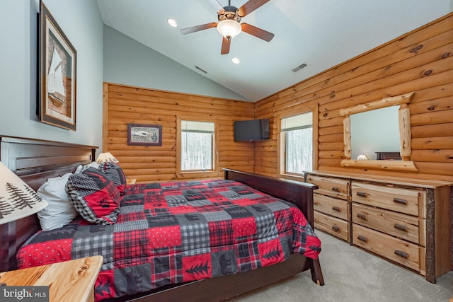 bedroom featuring light carpet, ceiling fan, lofted ceiling, and log walls