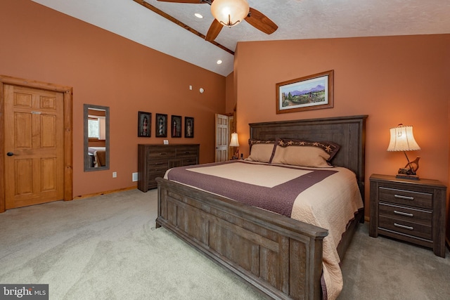 carpeted bedroom featuring a textured ceiling, high vaulted ceiling, and ceiling fan