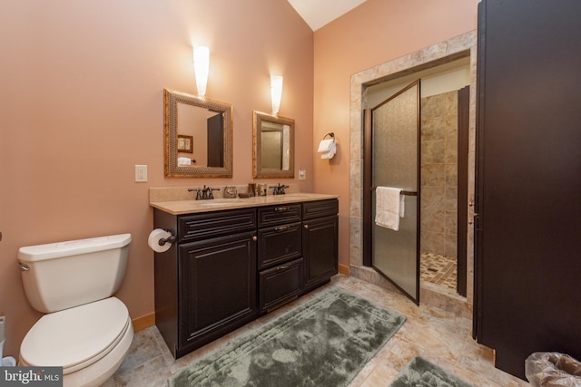 bathroom with vanity, toilet, and walk in shower